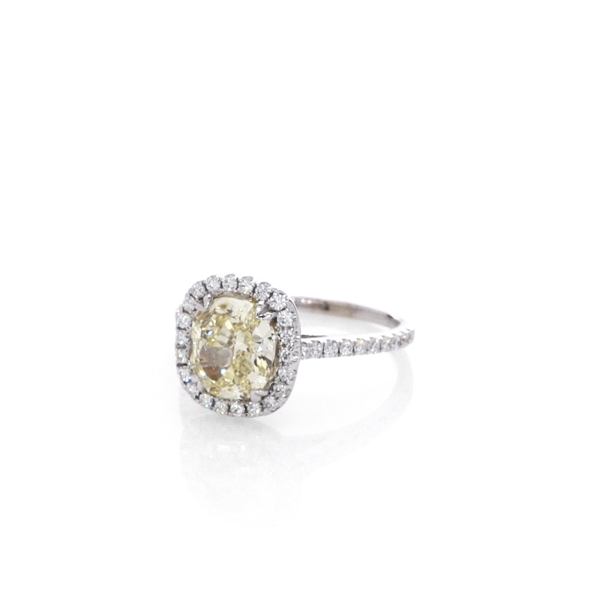 Luxurious Estate 14k White Gold Ring Featuring a Cushion Cut Fancy Yellow Diamond with Diamond Accents
