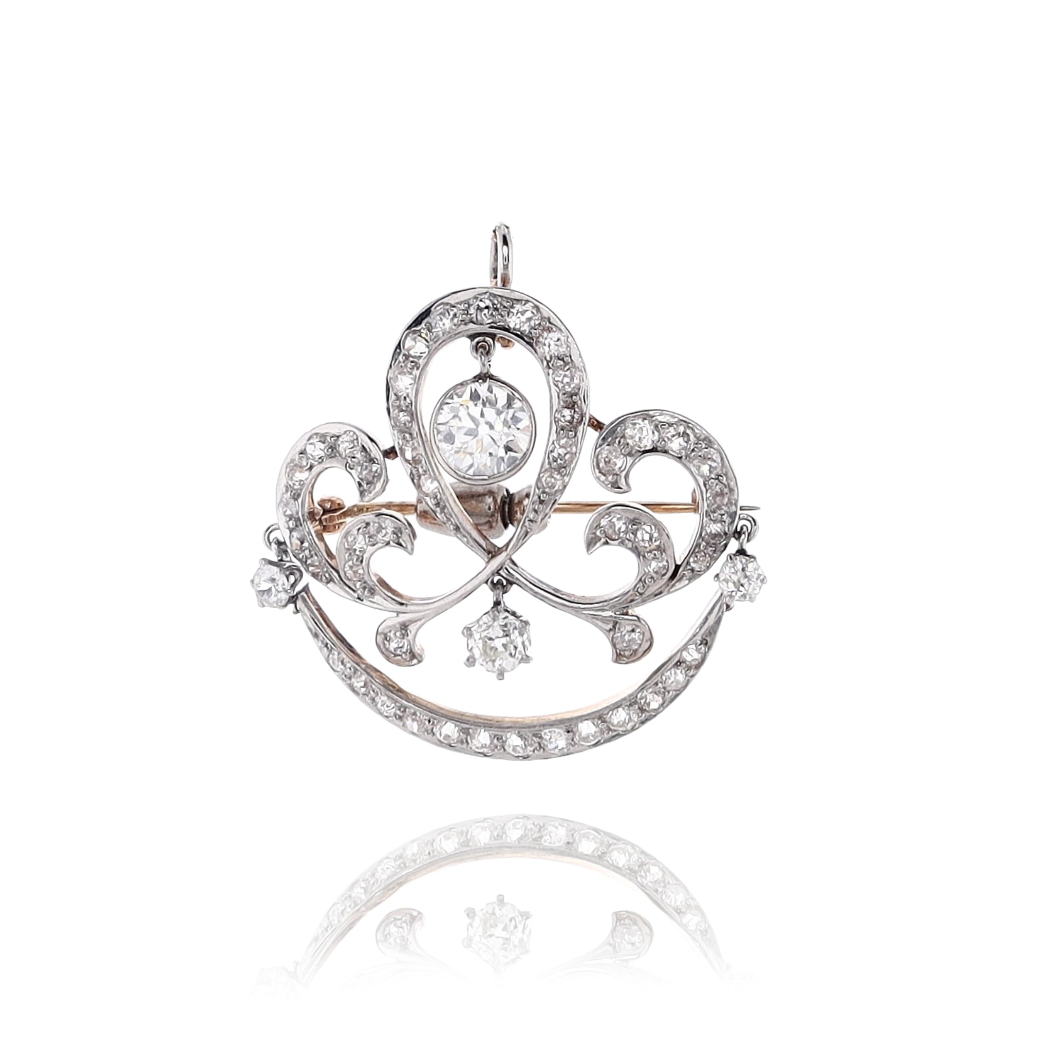 Elegant Estate 14 Karat Yellow Gold and Platinum Scroll Design Diamond Brooch for Fashion Accessorizing