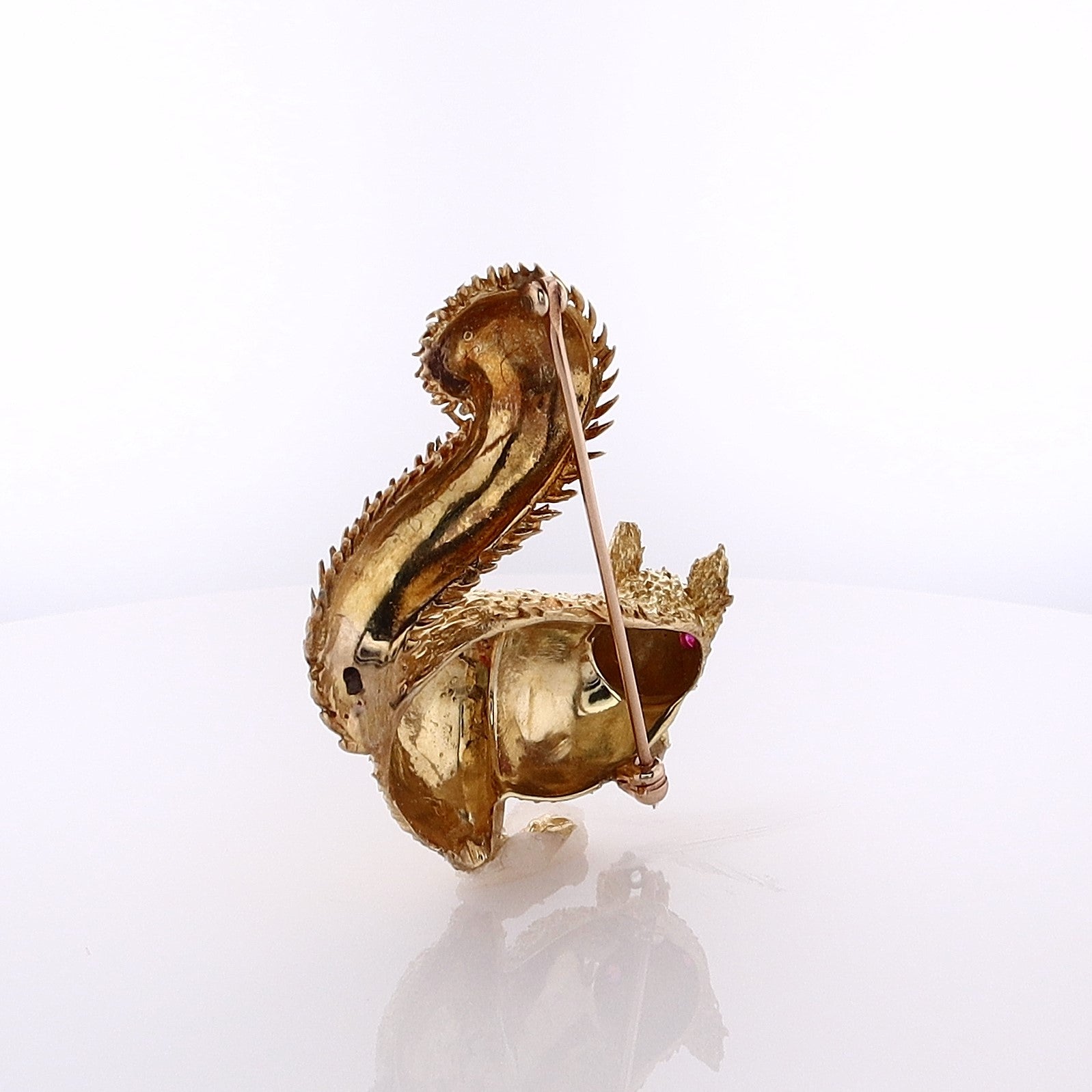 Exquisite Estate 18 Karat Yellow Gold Squirrel-Shaped Brooch Adorned with Round Ruby Eyes and a Diamond Nut for Jewelry Lovers