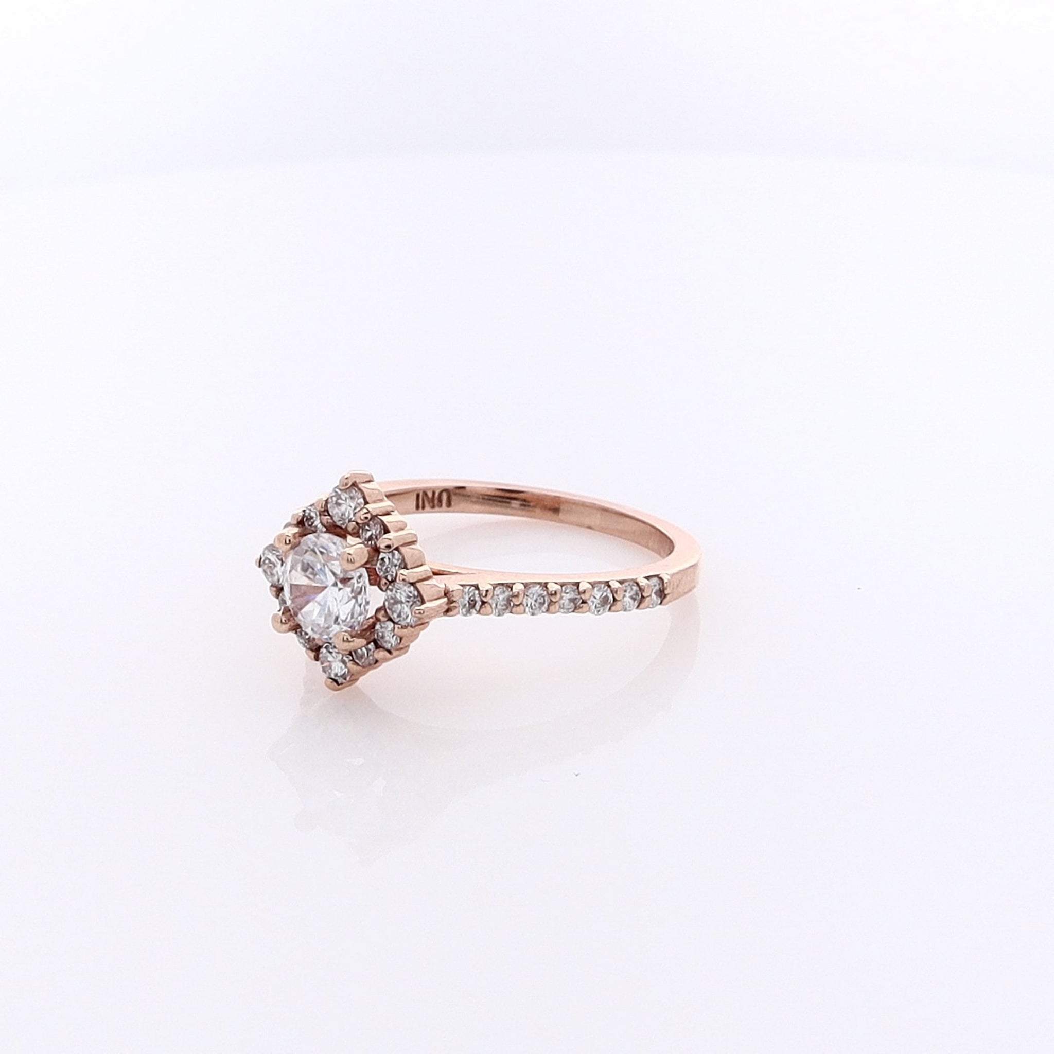 14 Karat Rose Gold Engagement Ring with Semi Pave Diamond Halo and Cubic Zirconium Center