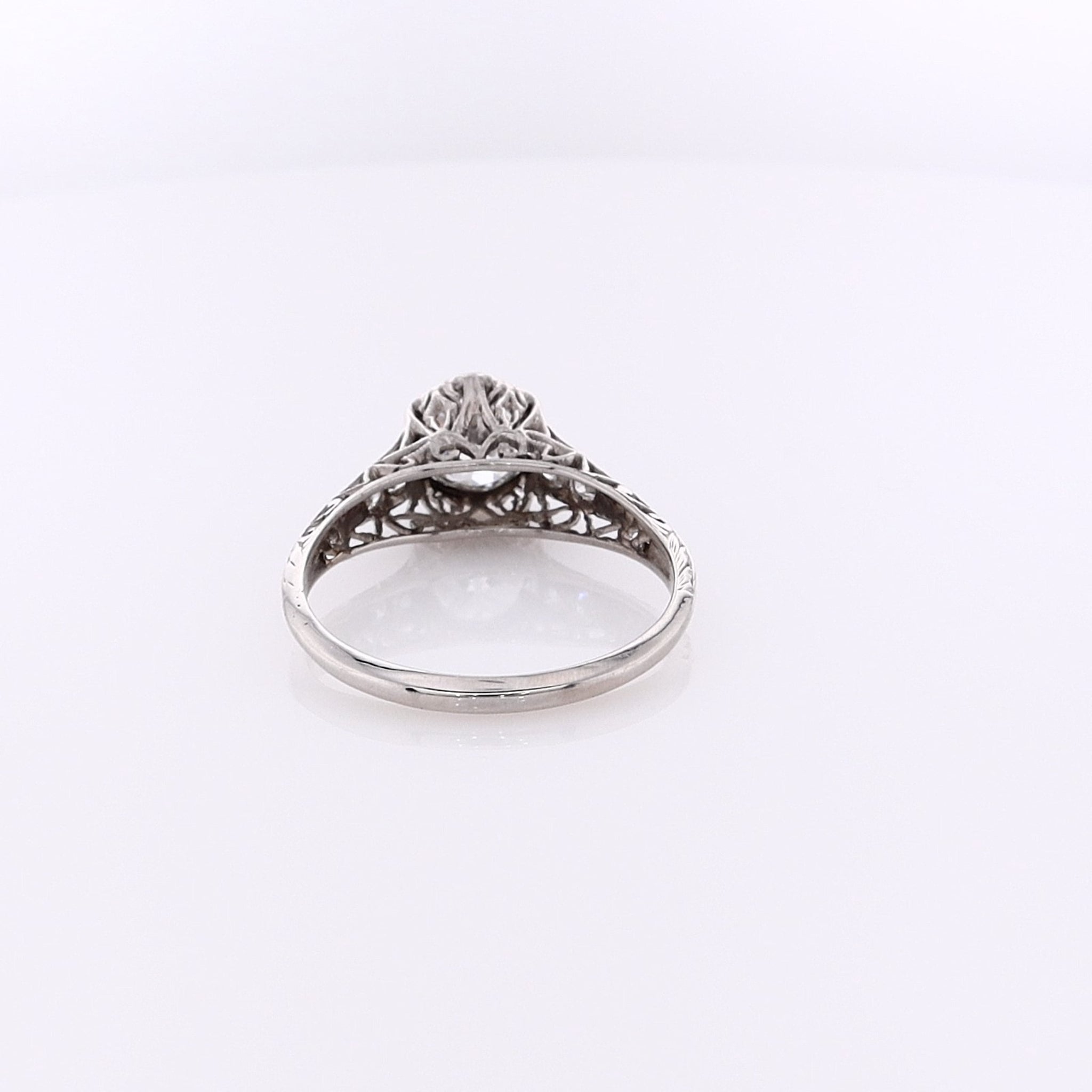 Exquisite Estate Platinum Diamond Engagement Ring with Hexagonal Head and Intricately Engraved Shank