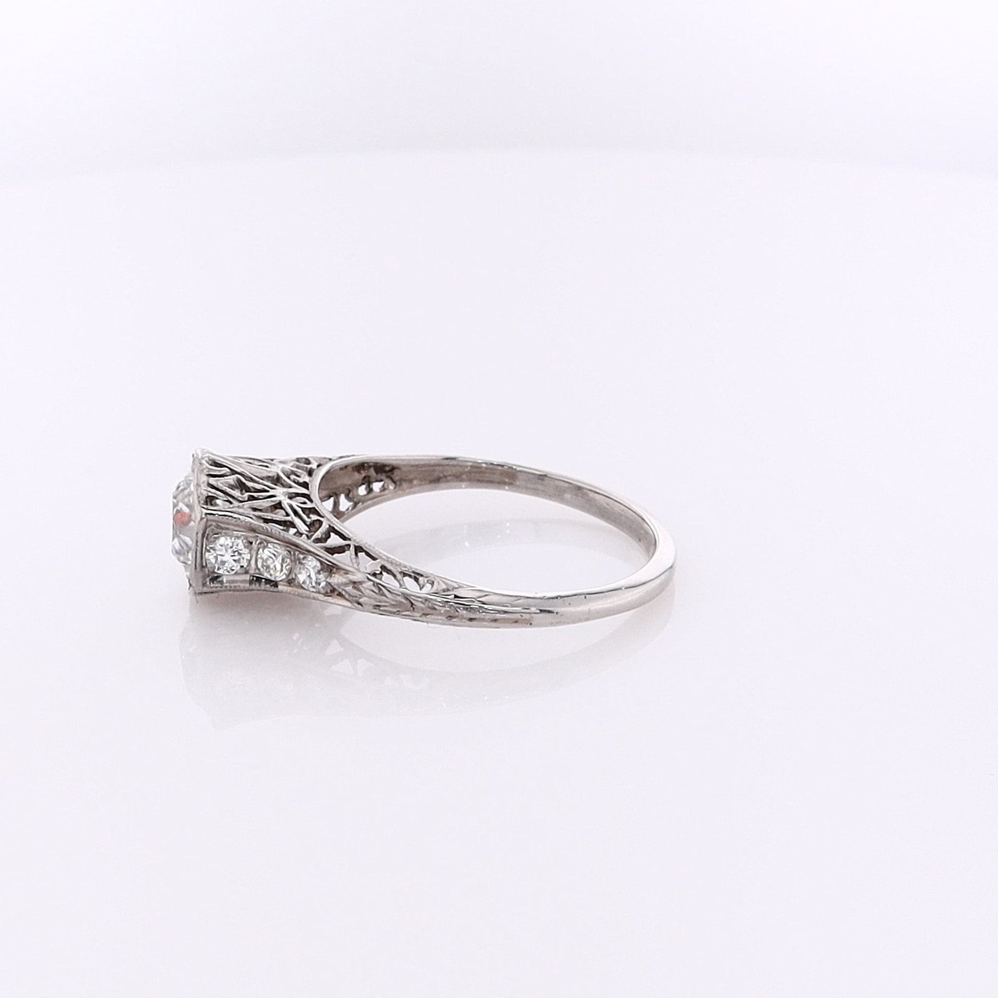 Exquisite Estate Platinum Diamond Engagement Ring with Hexagonal Head and Intricately Engraved Shank