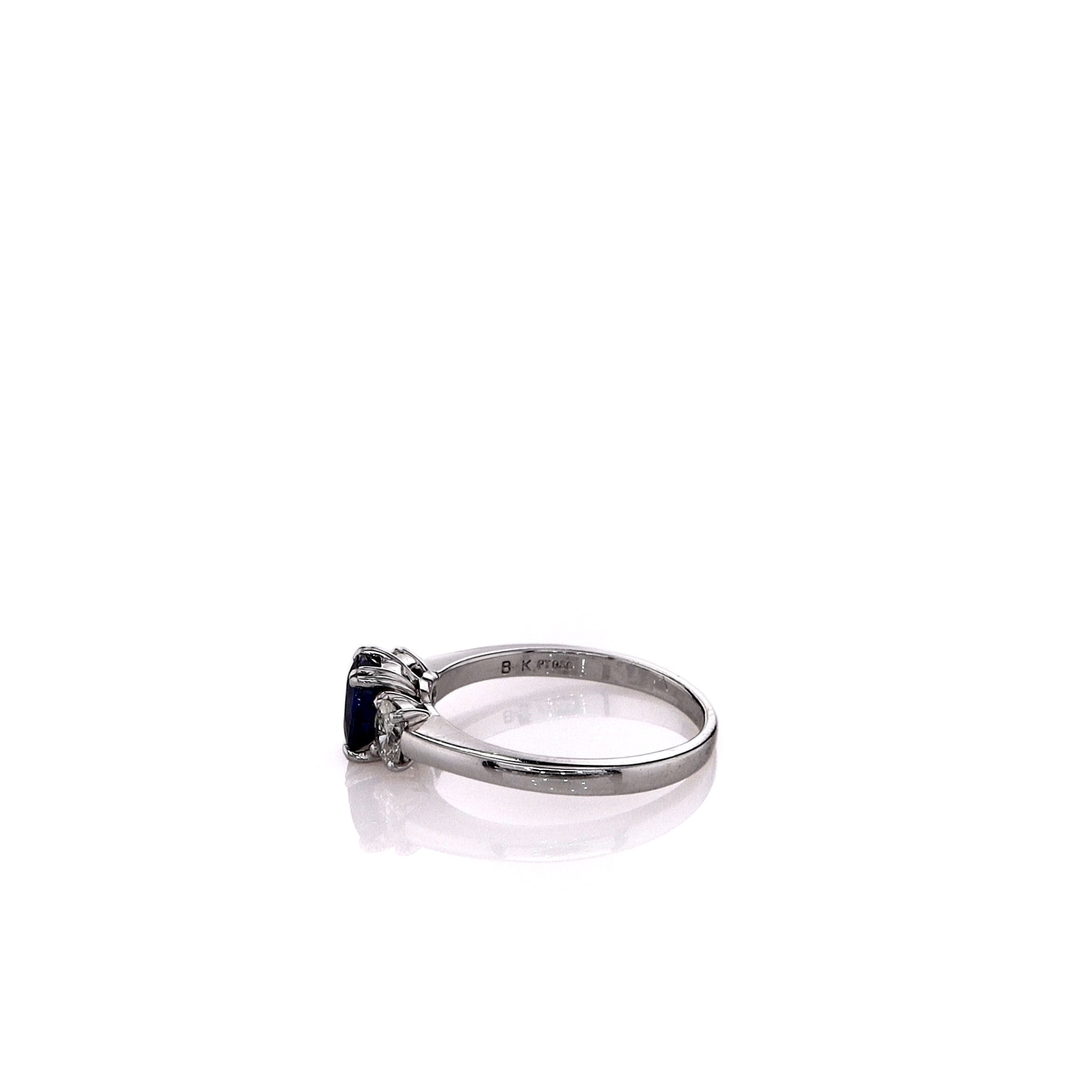 Exquisite Estate Platinum Engagement Ring Featuring 1.20ct Round Blue Sapphire and 0.40ct Oval Cut Diamonds